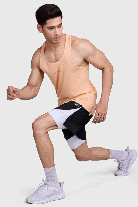 Fuaark Nz peach running tank top with subtle checks, lightweight and breathable fabric for sweat-wicking comfort during workouts.