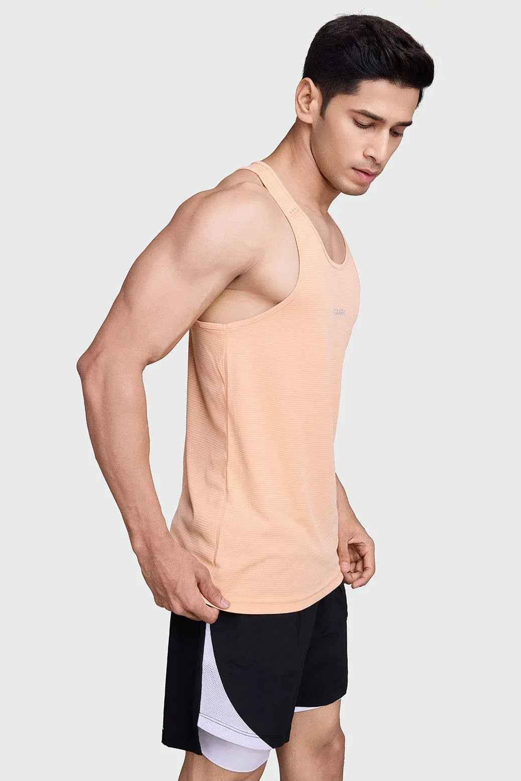 Peach Fuaark Nz running tank top with subtle checks, lightweight, breathable fabric and sweat-wicking comfort for active wear.