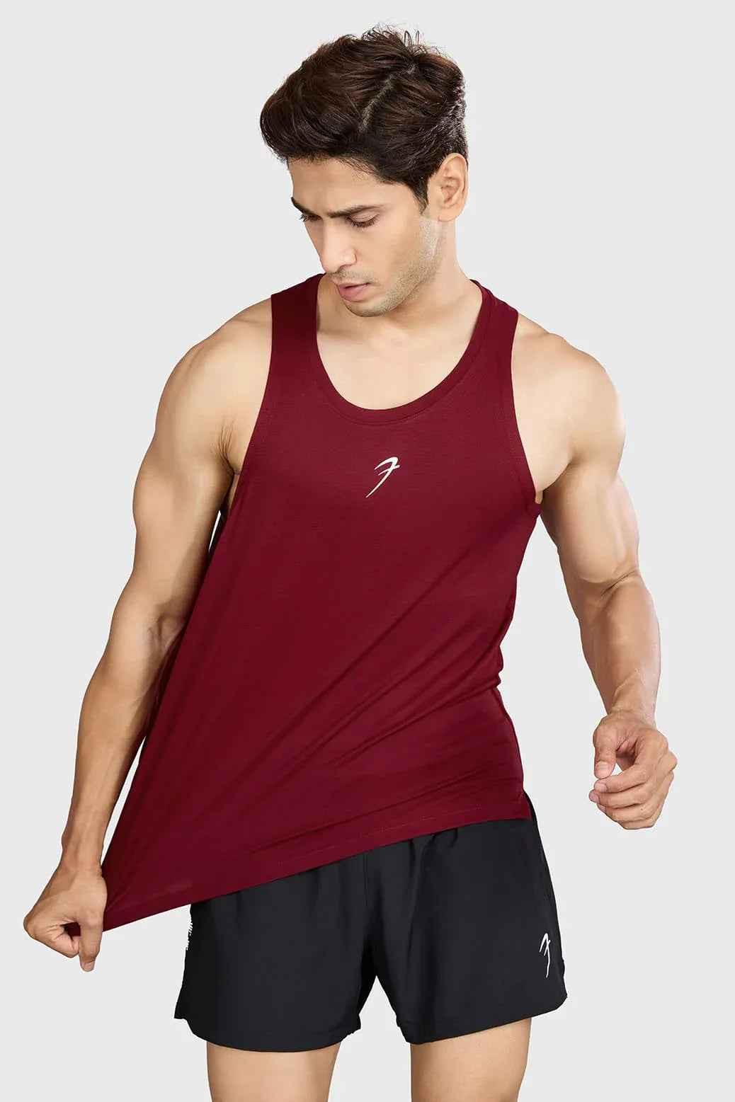 Deep red Pulse running tank top by Fuaark Nz, lightweight athletic sleeveless shirt, designed for active wear and comfort.