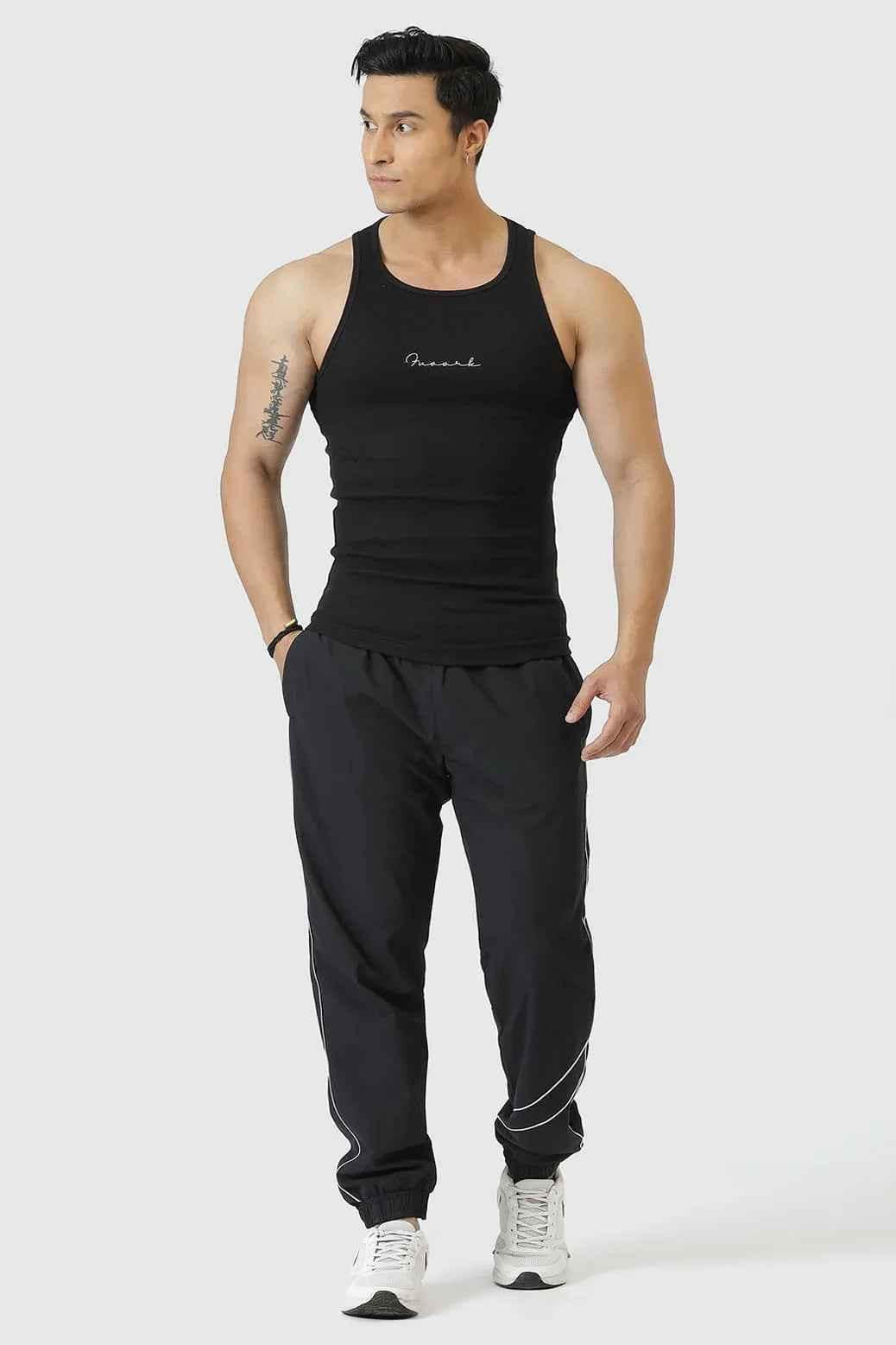 Ribbed black tank top from Fuaark Nz featuring a fitted design, perfect for casual wear and effortless style.
