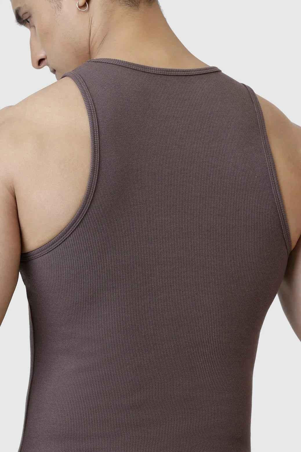 Brown ribbed tank top from Fuaark Nz, close-up of fabric texture and fit on a model.
