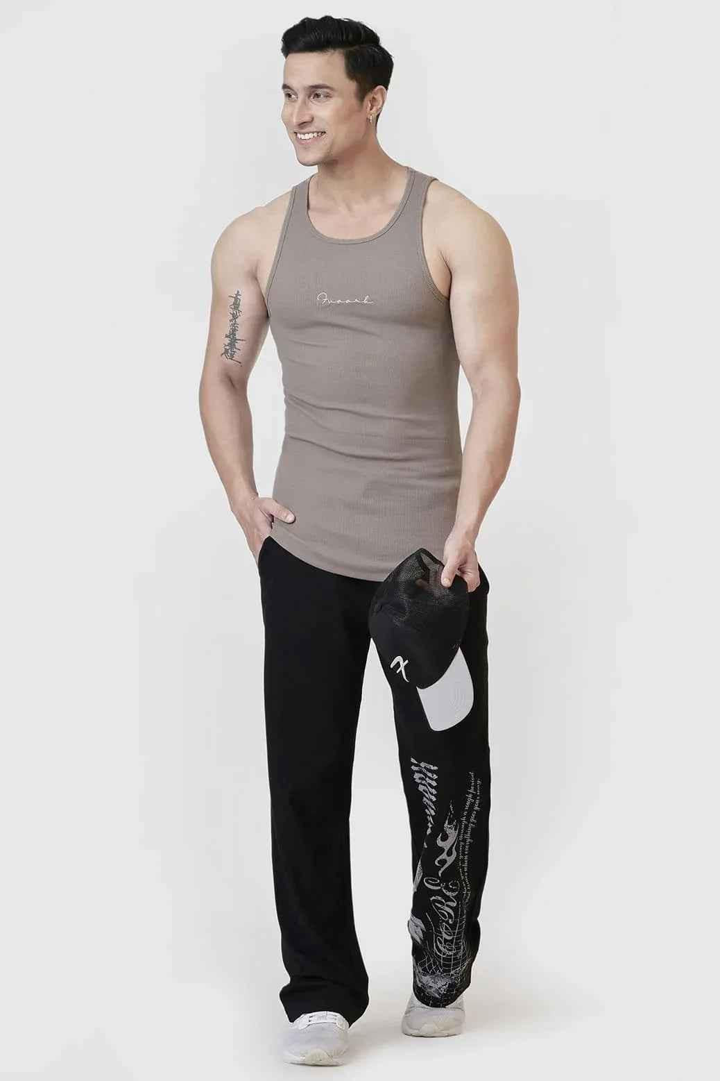 Warm beige ribbed tank top by Fuaark NZ, close-up of soft fabric and fitted style, ideal for casual summer wear.