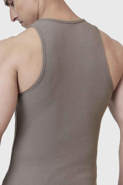 Warm beige ribbed tank top by Fuaark Nz, sleeveless, fitted style with textured ribbed fabric for casual wear.