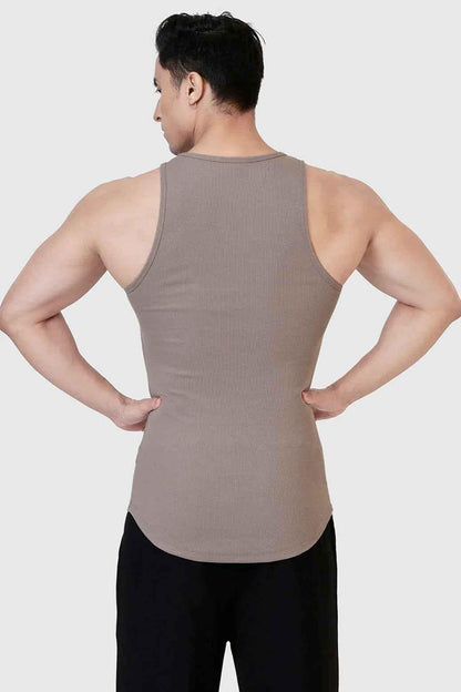 Warm beige ribbed tank top from Fuaark Nz, close-up view showing fitted design and textured fabric.