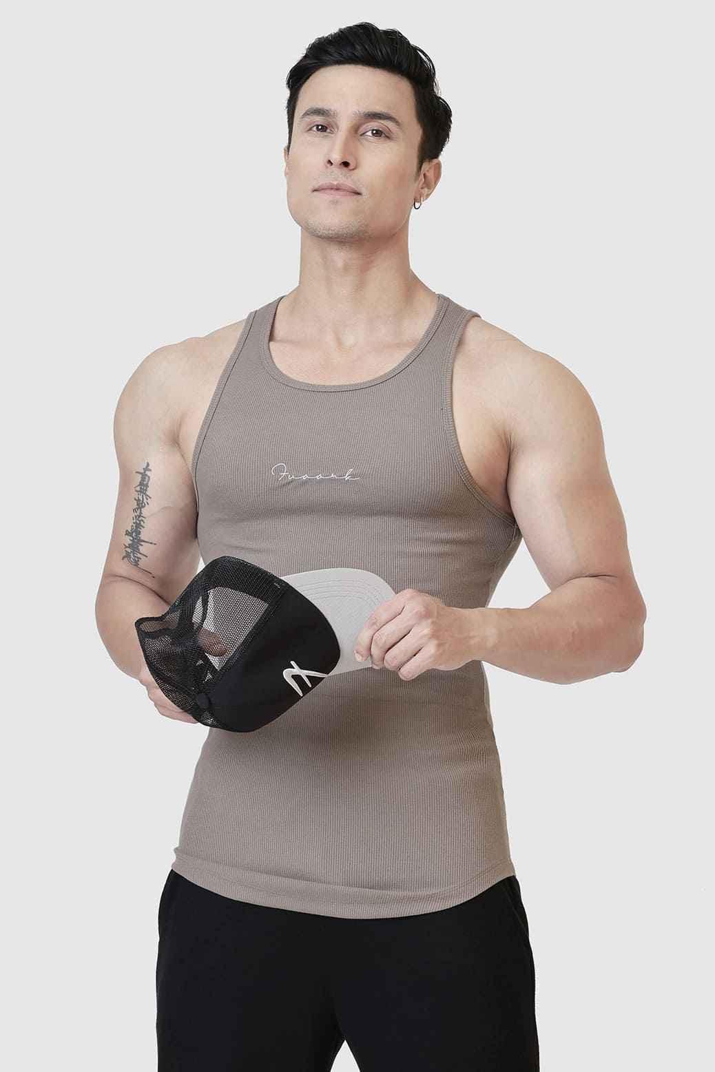 Warm beige ribbed tank top by Fuaark Nz featuring a fitted, sleeveless design perfect for casual wear.