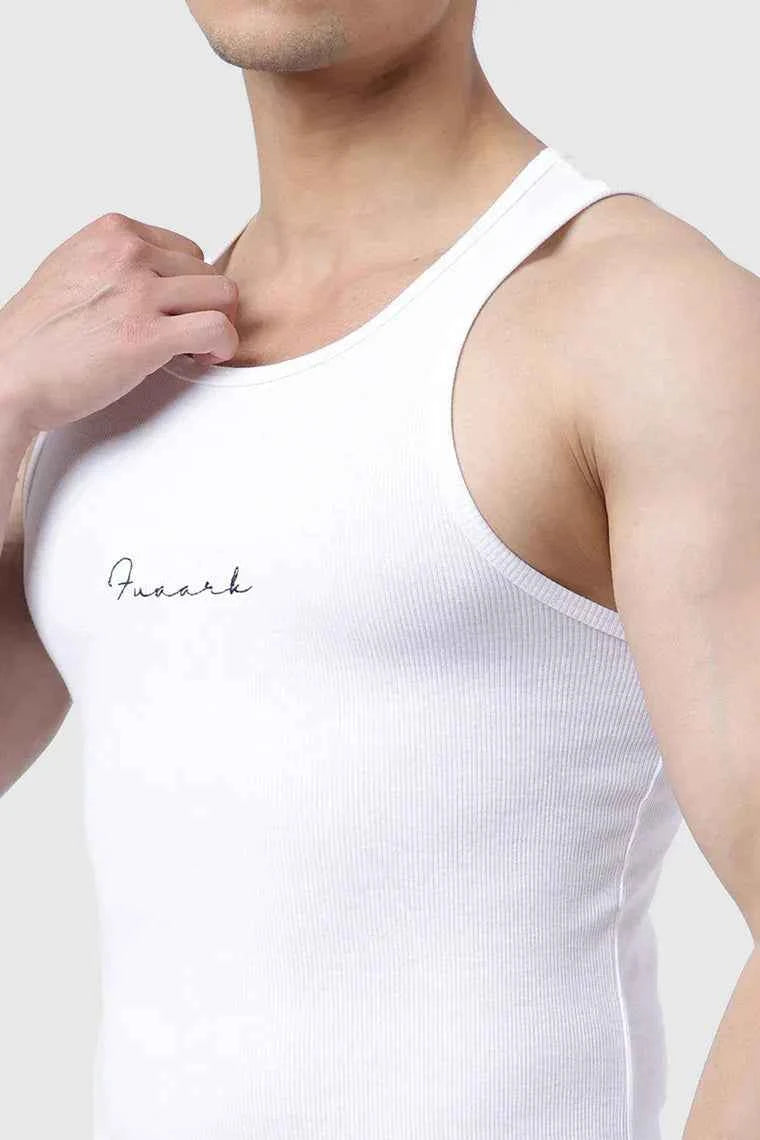 White ribbed tank top from Fuaark Nz, a close-up showing the fitted, textured fabric and sleeveless design.