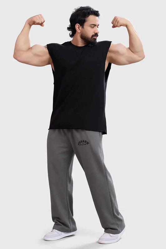 Black Shell Raw Capsleeves Tank Top by Fuaark Nz, showcasing a fitted sleeveless design on a white background.