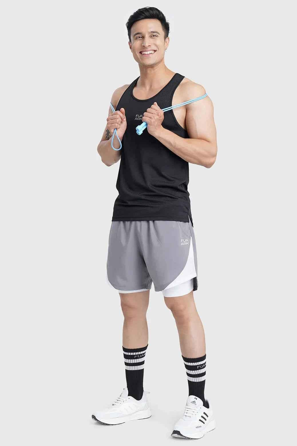 Fuaark Nz Sprint Black running tank top, lightweight and breathable performance tank top for active wear, shown on a model.