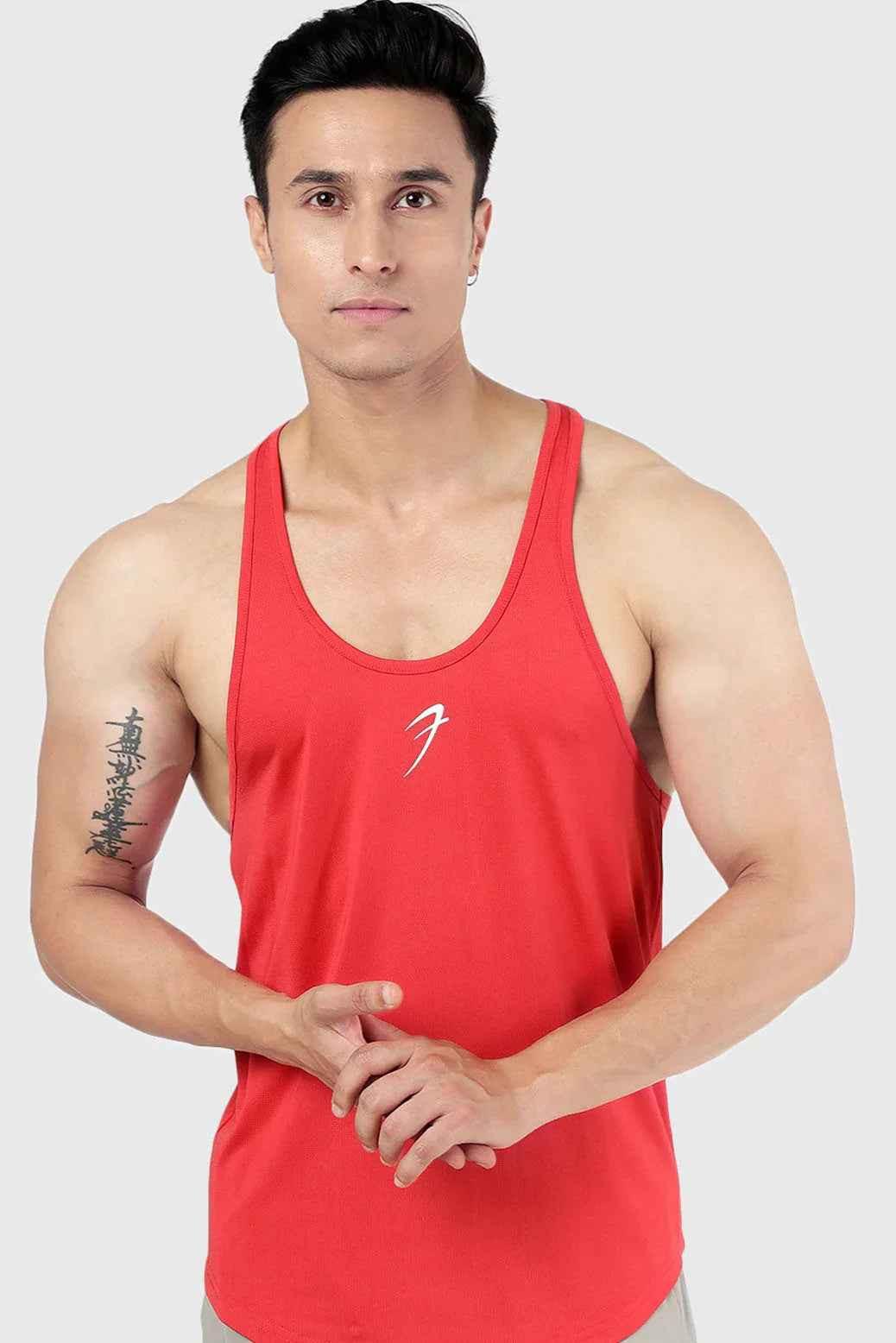 Fuaark NZ Surge Stringer Red tank top, fitted sleeveless athletic top with red fabric, suitable for gym and workout activities.