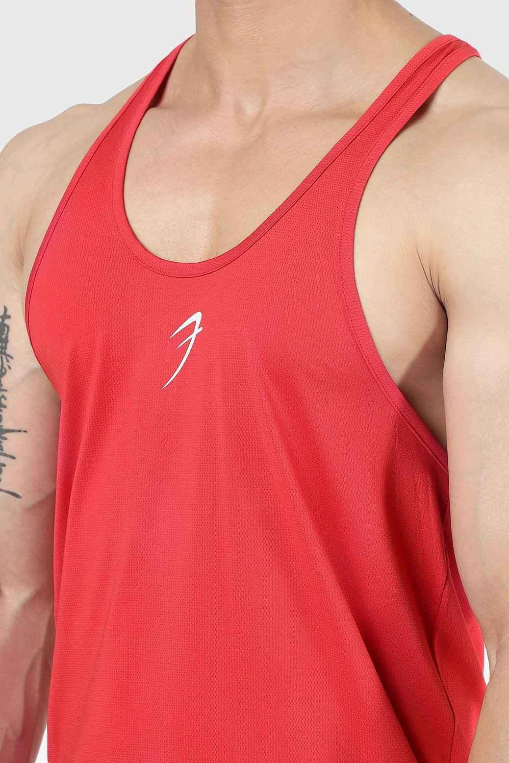 Red Surge Stringer tank top by Fuaark NZ, featuring a fitted athletic design and sleeveless style for active wear.
