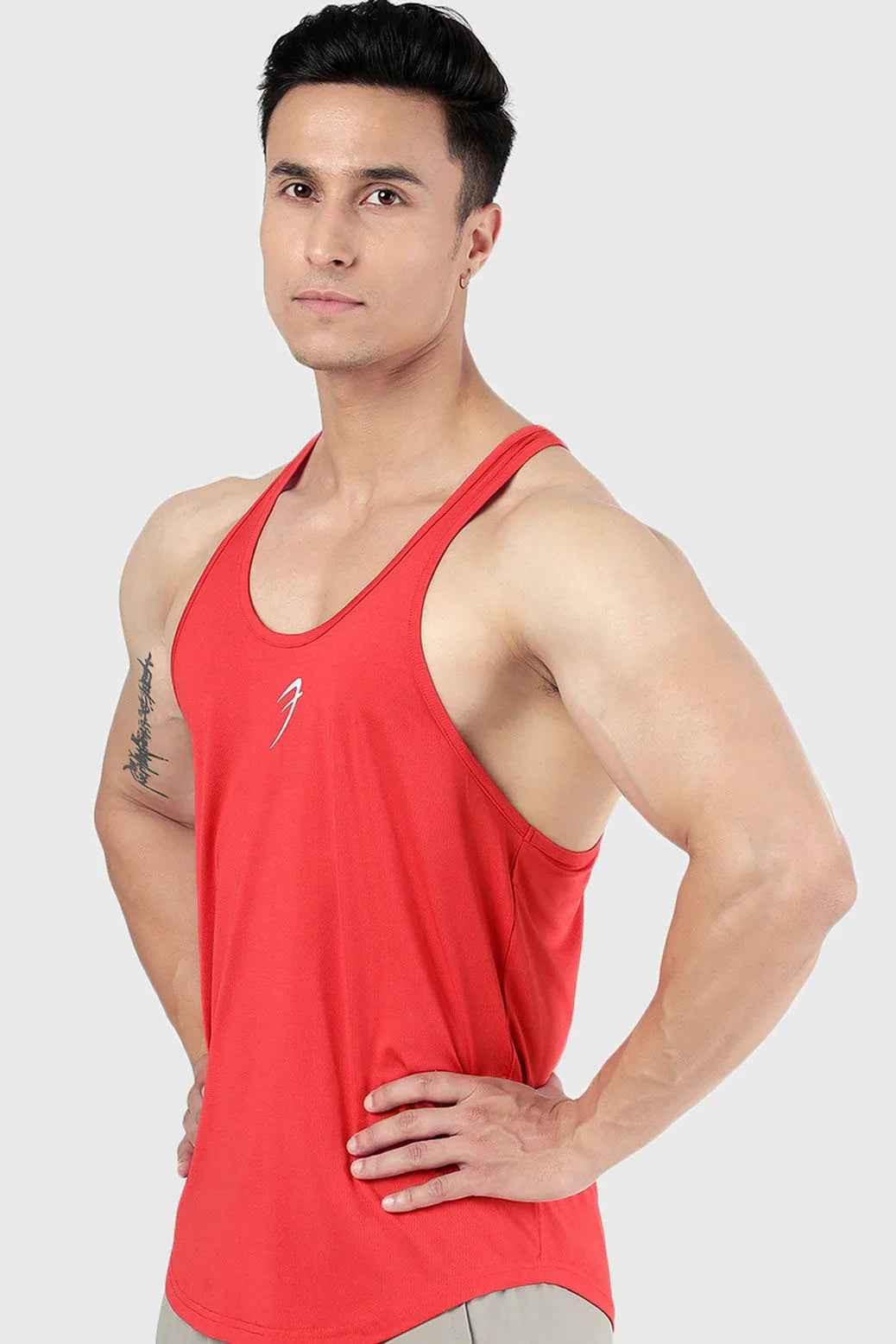 Red Surge Stringer tank top by Fuaark Nz, lightweight athletic shirt with sleeveless design and sporty fit.
