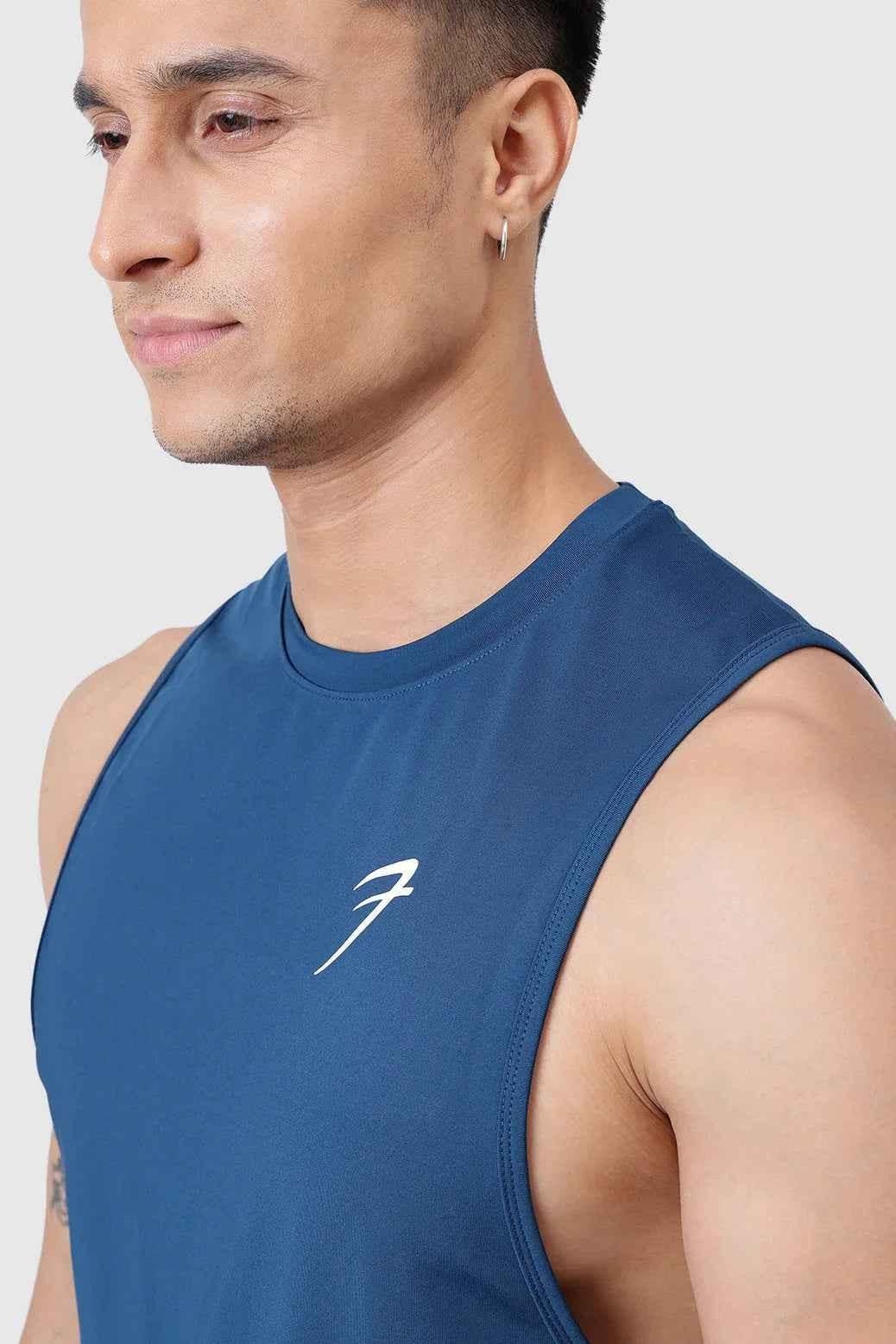 Teal Urban Deep Arm Tank Top by Fuaark Nz, sleeveless design with a relaxed fit, showcased on a model.