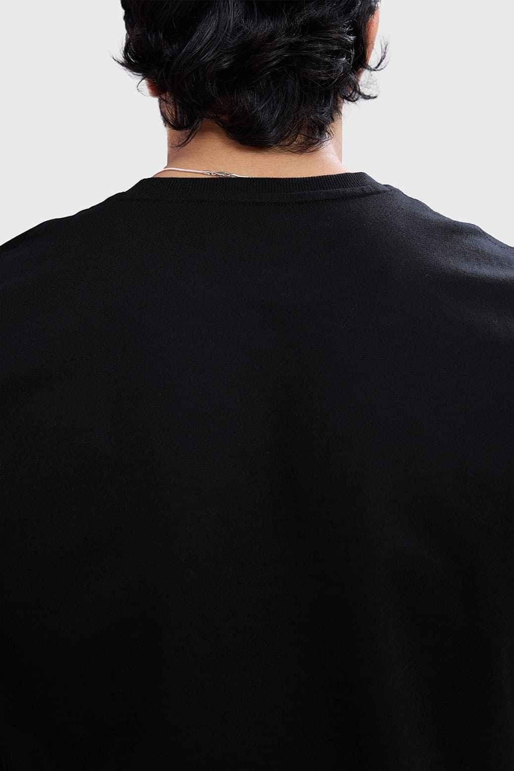 Black Fuaark Nz blackout cap-sleeves tank top, close-up of black sleeveless shirt with fitted style and soft fabric.