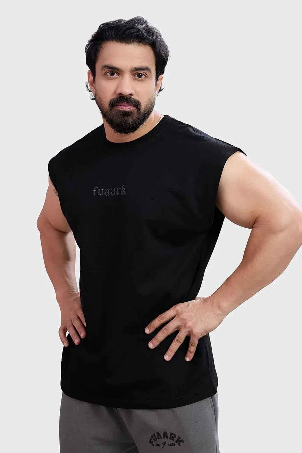 Black Fuaark Nz blackout cap-sleeves tank top shown on model, close-up view highlighting black fabric and sleeveless design.