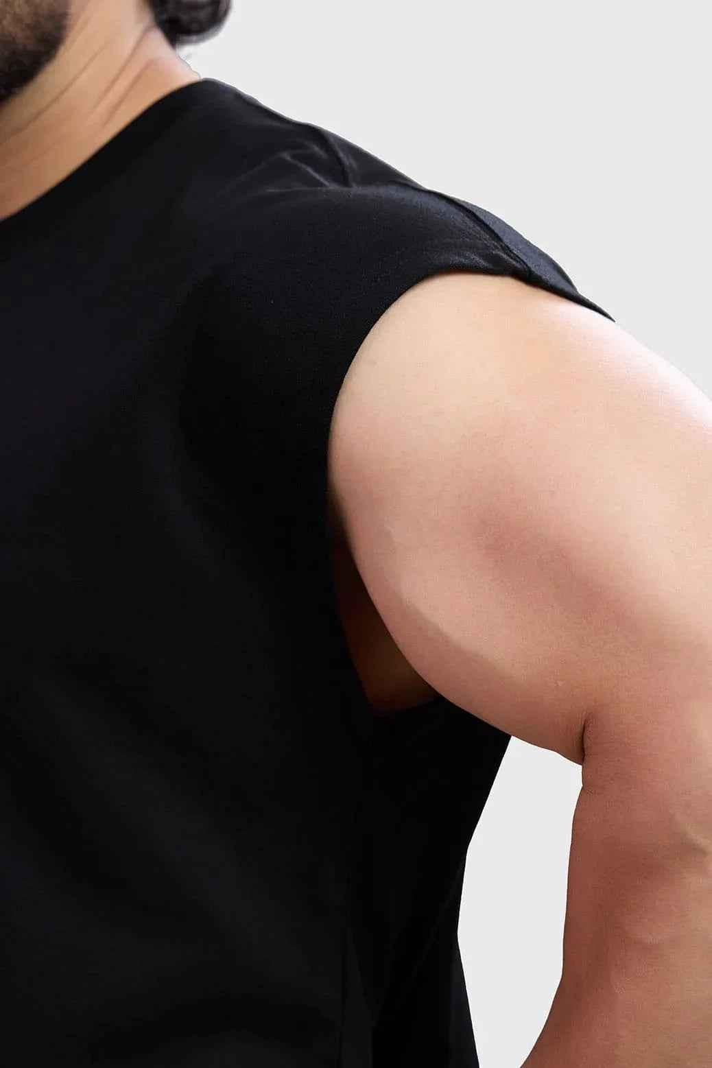 Black tank top by Fuaark Nz, stylish sleeveless top for casual wear, featuring a sleek fit and versatile design for everyday use.