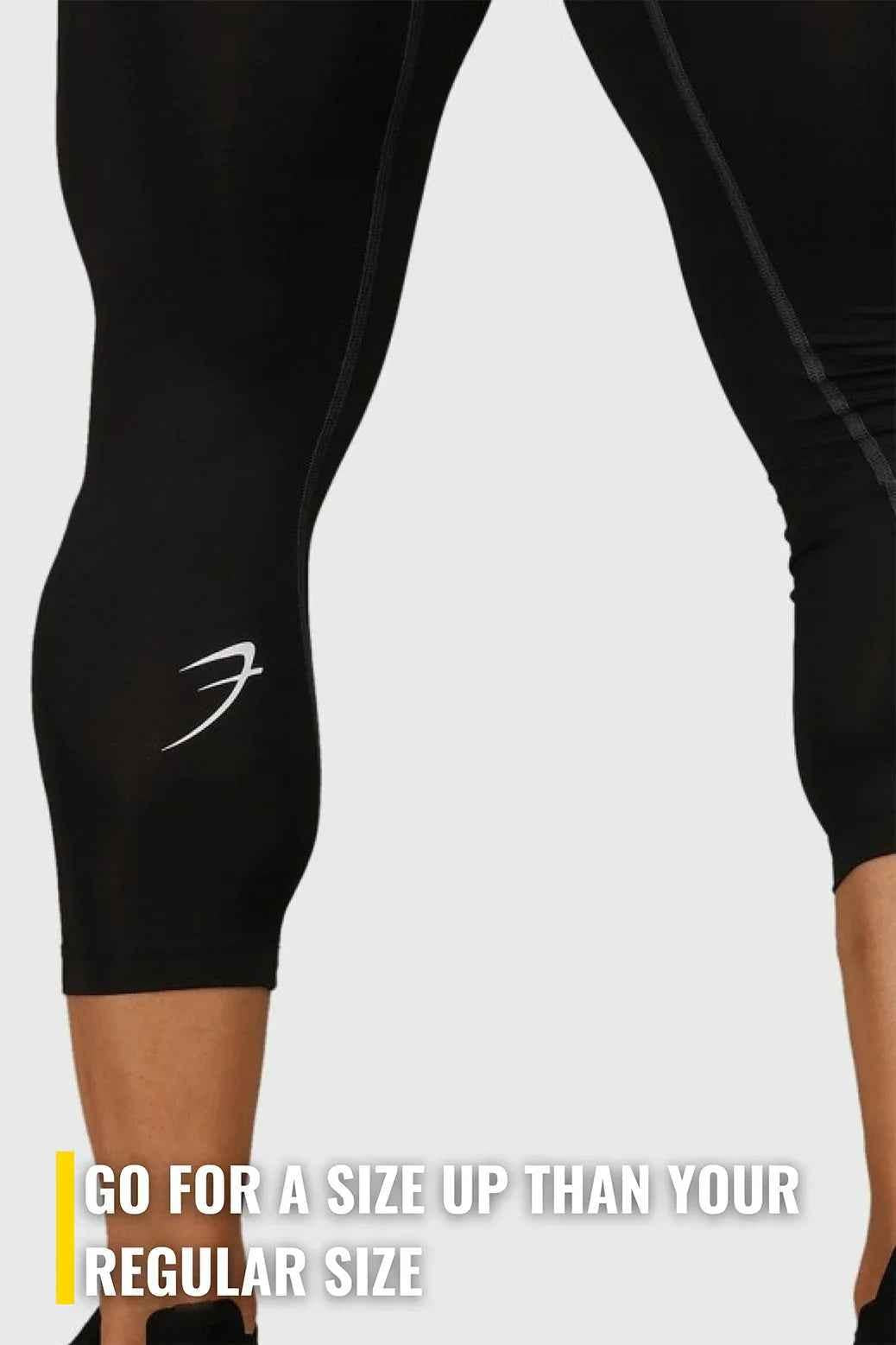 Black Fuaark Nz compression tights displayed on a model, showing their snug fit and stretch for athletic or casual wear.