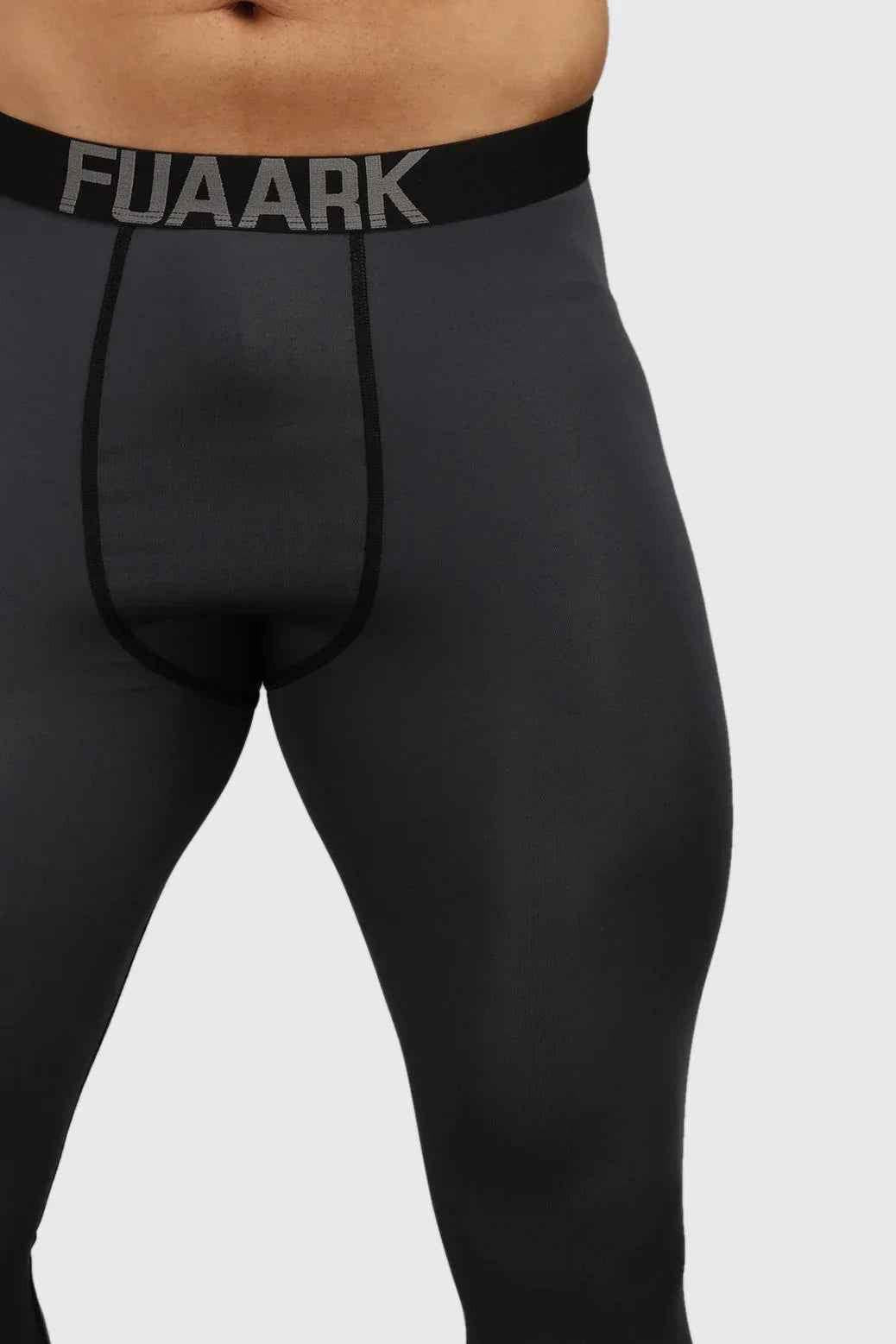 Dark grey compression tights by Fuaark NZ showing a close-up of the stretchy, snug-fitting fabric designed for support and comfort.