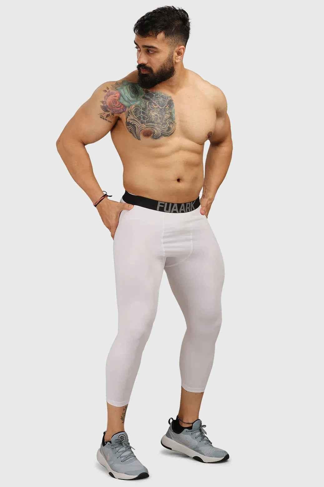 White compression tights by Fuaark Nz, high-performance workout tights with a snug fit and breathable fabric for active wear.