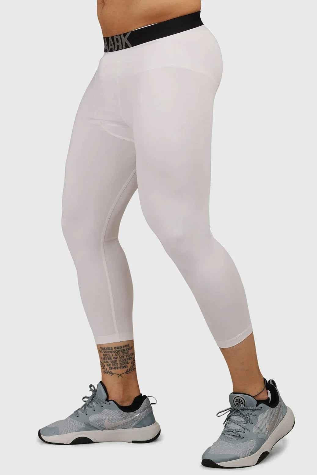 White compression tights by Fuaark Nz designed for high-performance workouts, featuring a snug fit and breathable fabric.