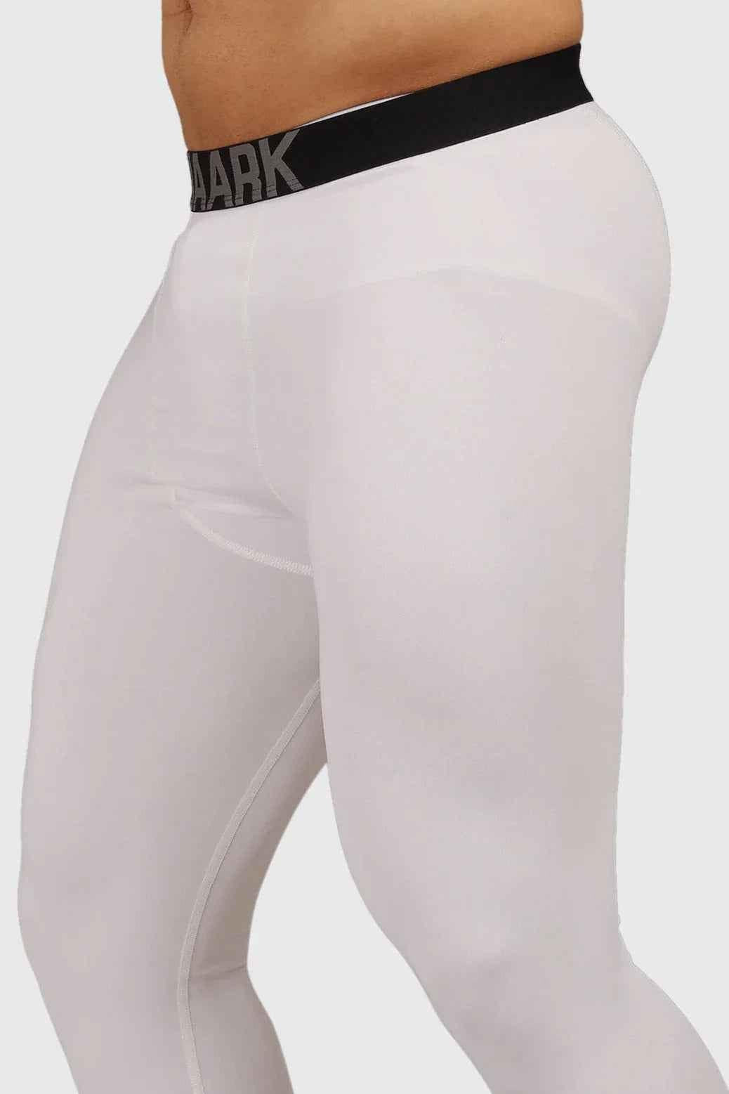 White compression tights by Fuaark Nz, high-performance workout tights designed for support and comfort during exercise.