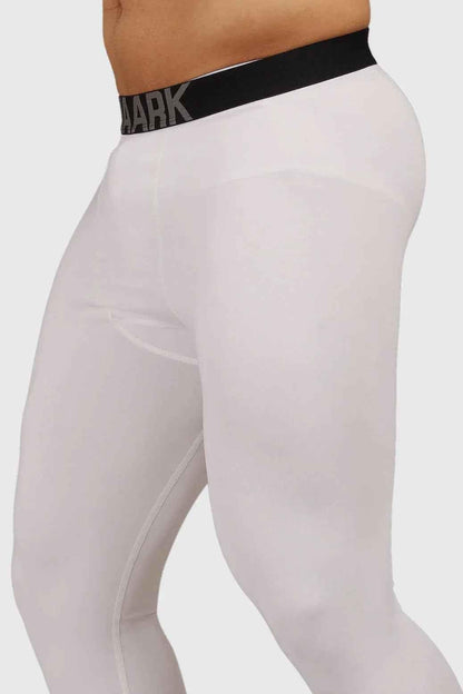 White compression tights by Fuaark Nz, high-performance workout tights designed for support and comfort during exercise.