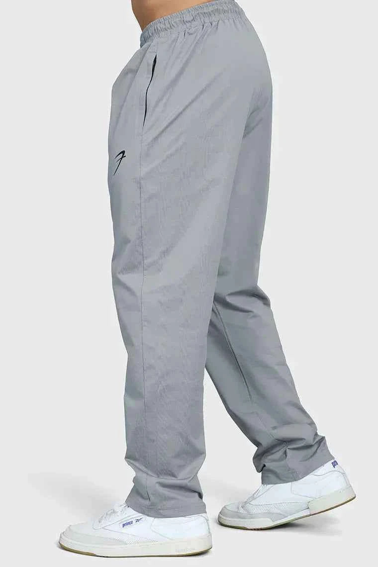 Fuaark Nz smart casual light grey track pants, comfortable fit, featured on a model, ideal for casual or athletic wear