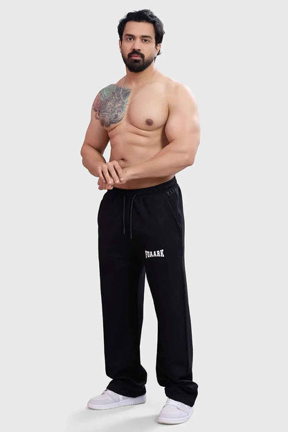 Fuaark Nz black track pants featuring luxurious dark straight hair-style details for a sleek, effortless look.