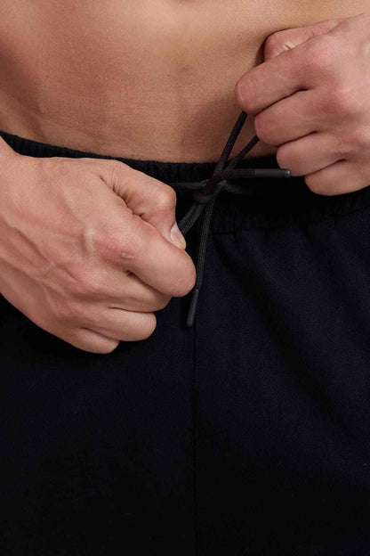 Fuaark Nz dark straight hair tracks pants in size XS, showcasing sleek, luxurious straight hair and stylish track pant design.