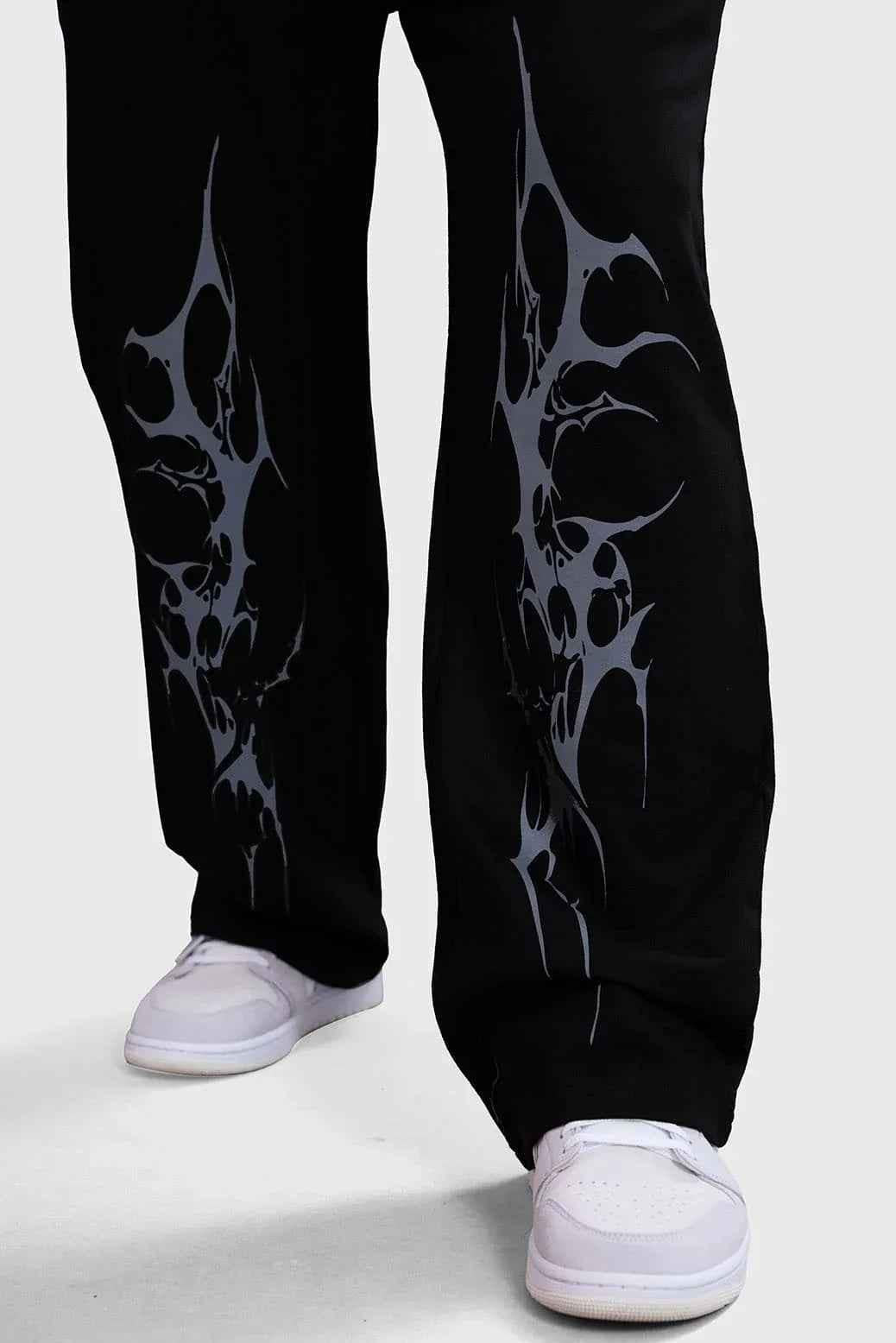 Black Phantom Straight Track Pants by Fuaark NZ, shown on a model, featuring a sleek fit and athletic style.