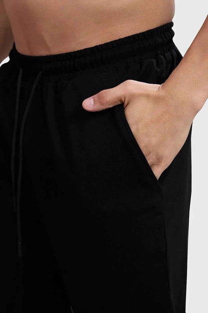 Fuaark Nz Ressiliant Straight Tracks black track pants laid flat on a white background.