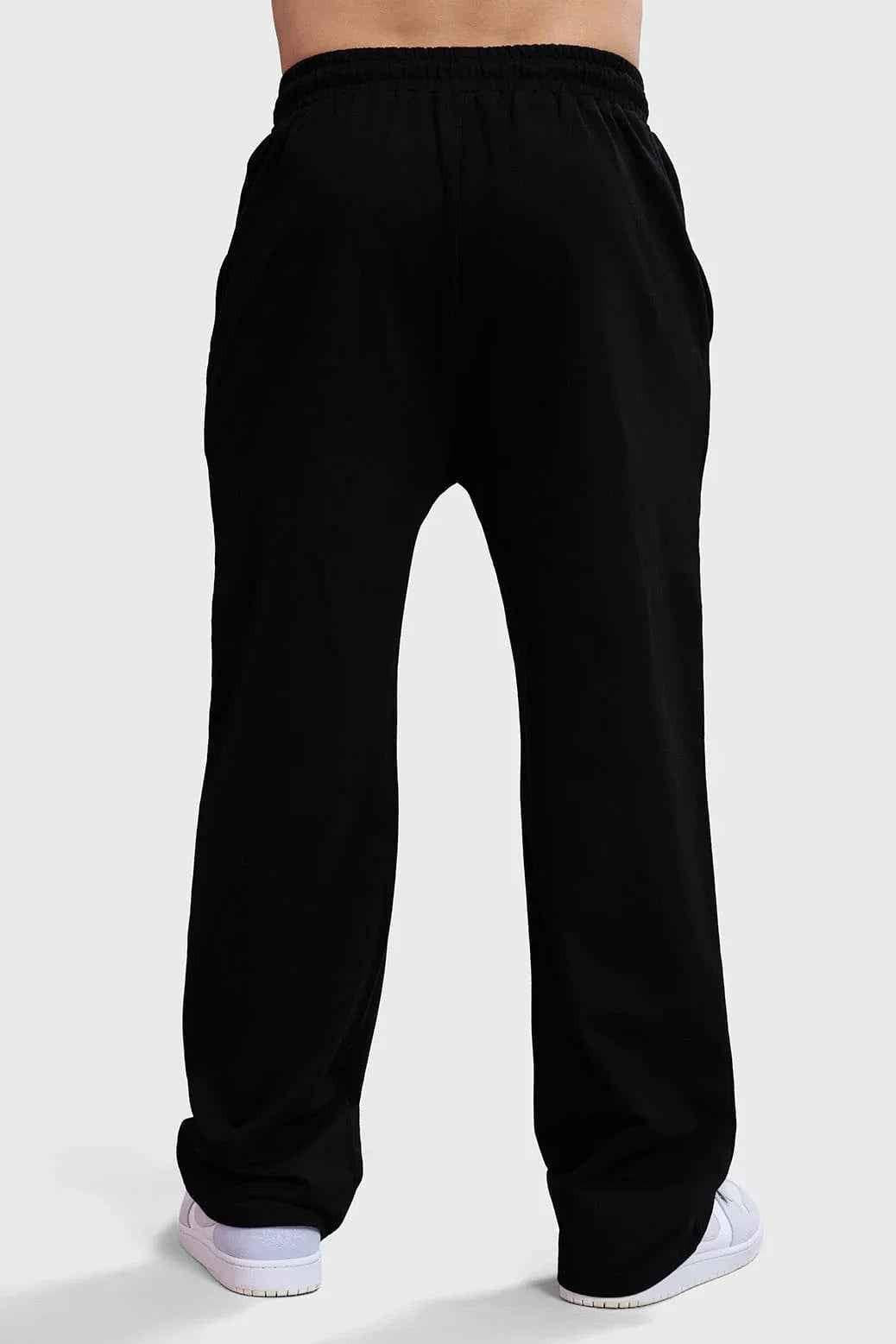 Fuaark Nz Ressiliant Straight Tracks Black track pants laid flat, showcasing the fit and sleek black design.