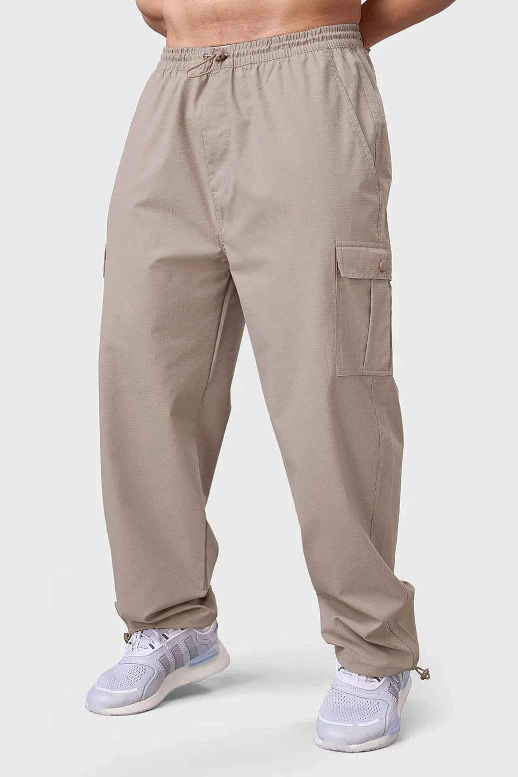 Beige Fuaark NZ Carpenter Cargo Pants track pants with multiple pockets and relaxed fit, designed for durability and comfort.