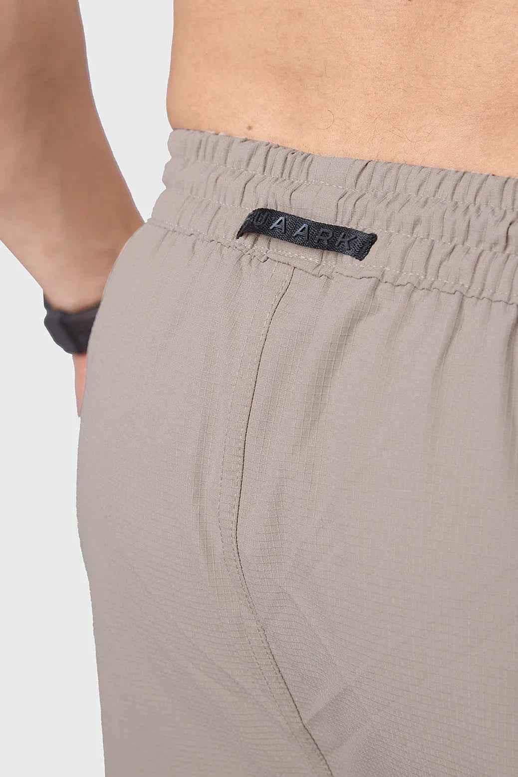 Fuaark Nz beige carpenter cargo track pants with multiple pockets and relaxed fit, suitable for work or casual wear.