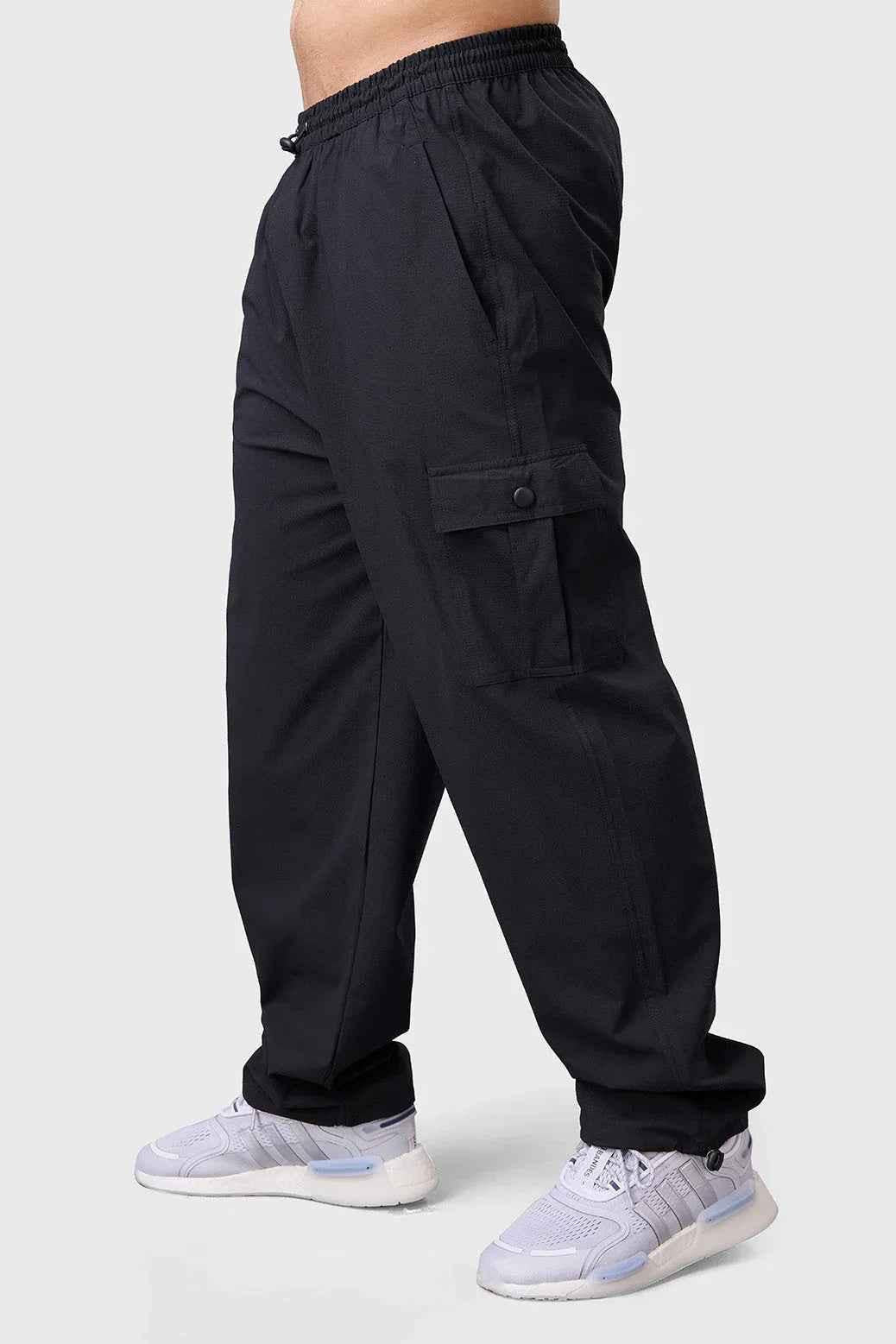 Black Fuaark Nz carpenter cargo pants designed for comfort and durability, featuring multiple pockets and a relaxed track style.