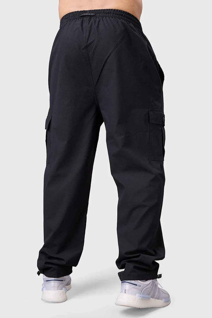Black Fuaark Nz Carpenter Cargo Pants designed for track wear, featuring multiple pockets and a comfortable fit.