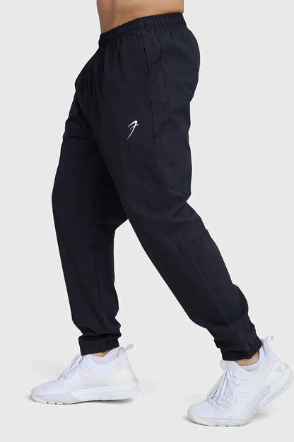 Fuaark Nz black track joggers with a relaxed fit, elastic waist, and stylish design for comfort and casual wear.