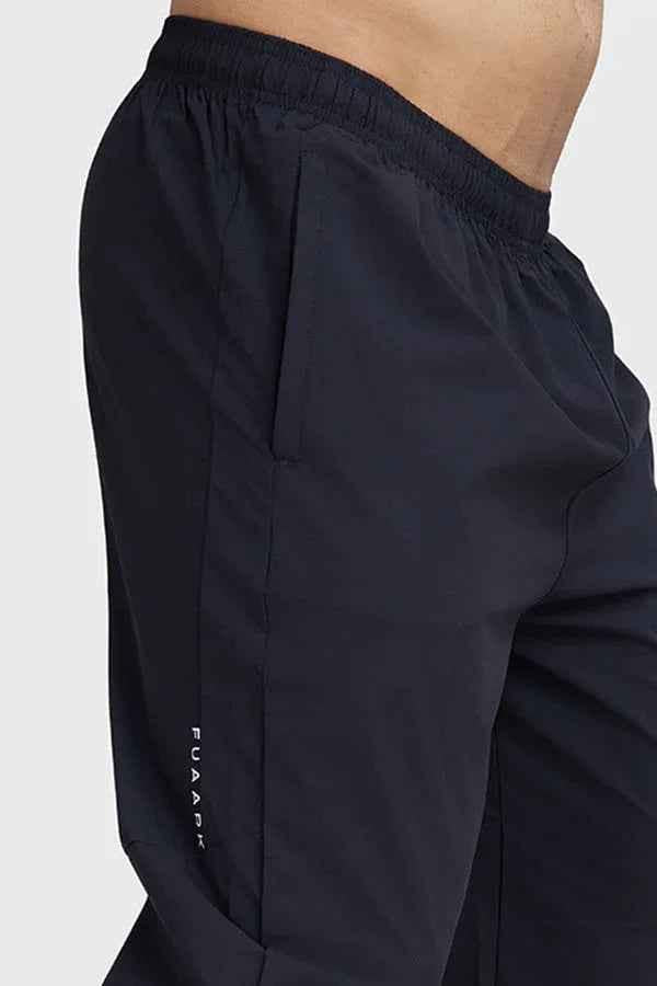 Fuaark Nz black track joggers for men, featuring a comfortable fit and stylish design, suitable for casual wear and workouts.