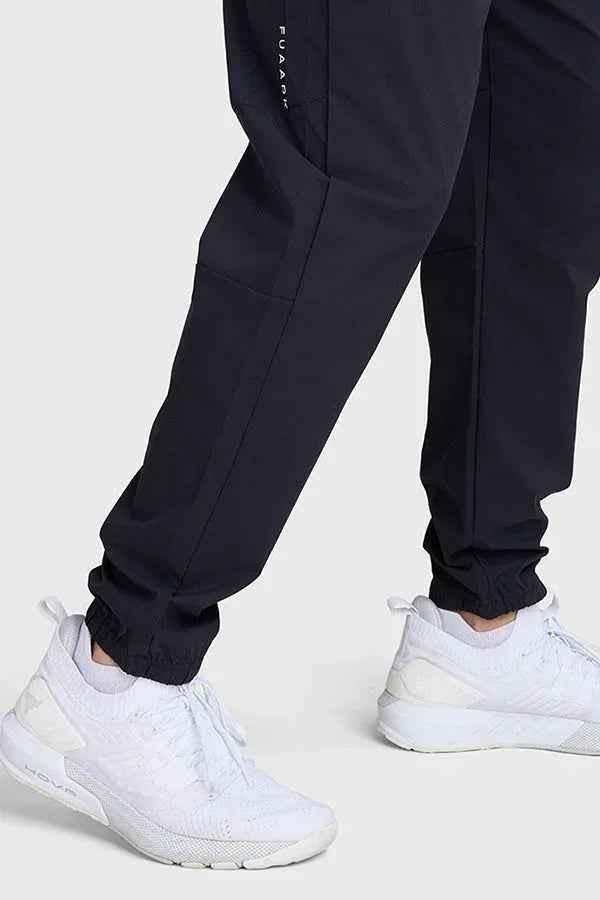 Fuaark Nz black track joggers for men, made of soft fabric, featuring a comfortable fit and stylish design.