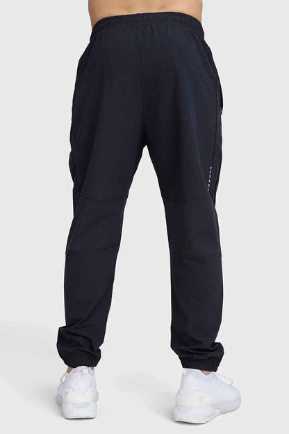Fuaark Nz black track joggers with a relaxed fit, featuring elastic waistband and cuffs for comfortable, stylish casual wear.