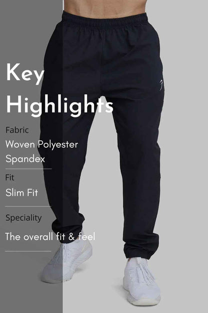 Fuaark Nz black track joggers for men, featuring a comfortable fit and stylish design, perfect for casual or athletic wear.