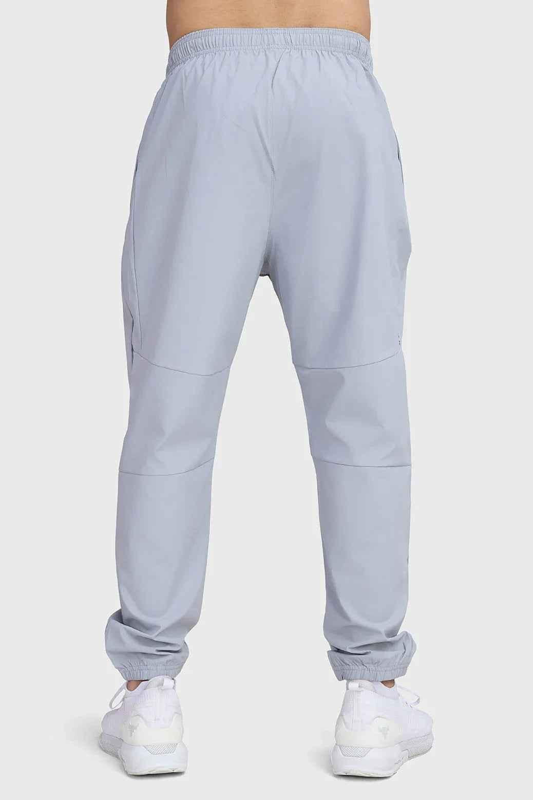 Light grey Fuaark Nz Essential Joggers, slim-fit track pants with elastic waistband and side pockets, casual athletic wear.