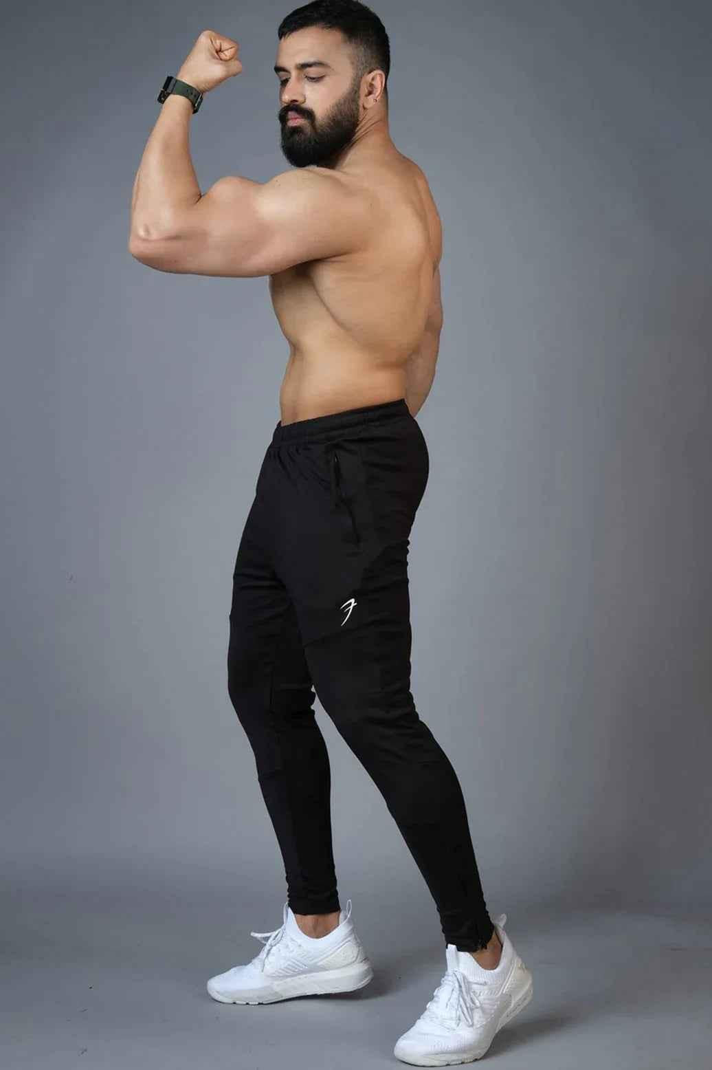 Fuaark Nz Hybrid Slim Tracks in black, showcasing sleek design and durable track material for active outdoor wear.