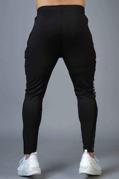Fuaark Nz Hybrid Slim Tracks in black, sleek and lightweight track shoes with durable design for athletic activities.