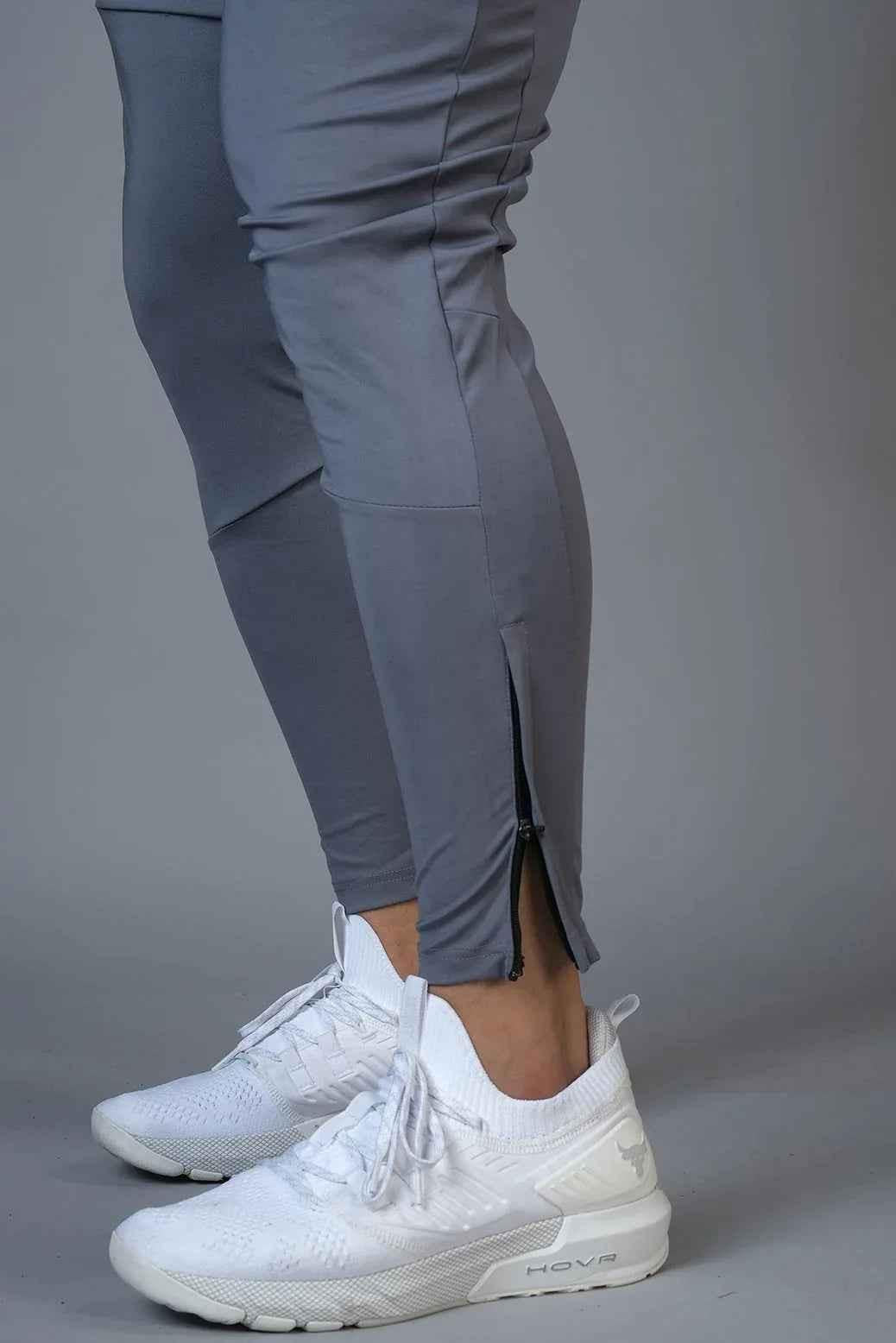 Fuaark Nz hybrid slim track shoes designed for enhanced performance and stylish athletic wear, shown with sleek black design.