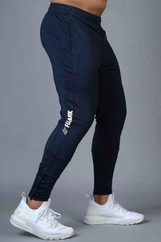 Fuaark Nz Hybrid Slim Tracks in navy, a sleek athletic track pants with a modern fit and sporty design.