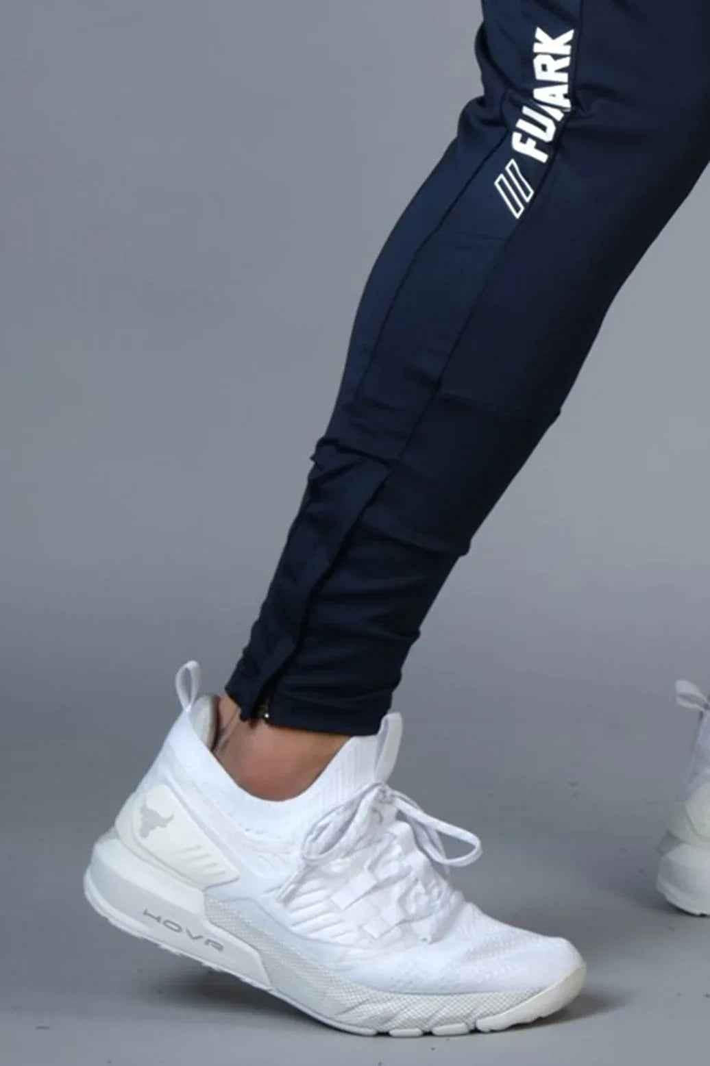Fuaark Nz hybrid slim navy track pants displayed in a casual fit, featuring a sleek design and comfortable fabric.