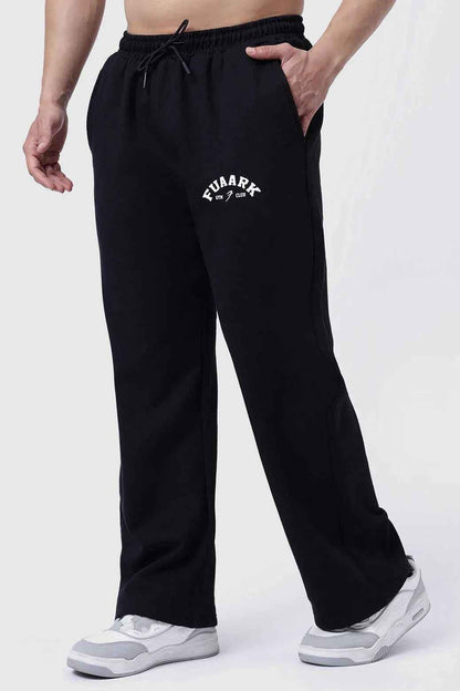 Fuaark NZ laidback relaxed black track pants, comfortable and stylish, shown on a model with casual fit and elastic waistband.