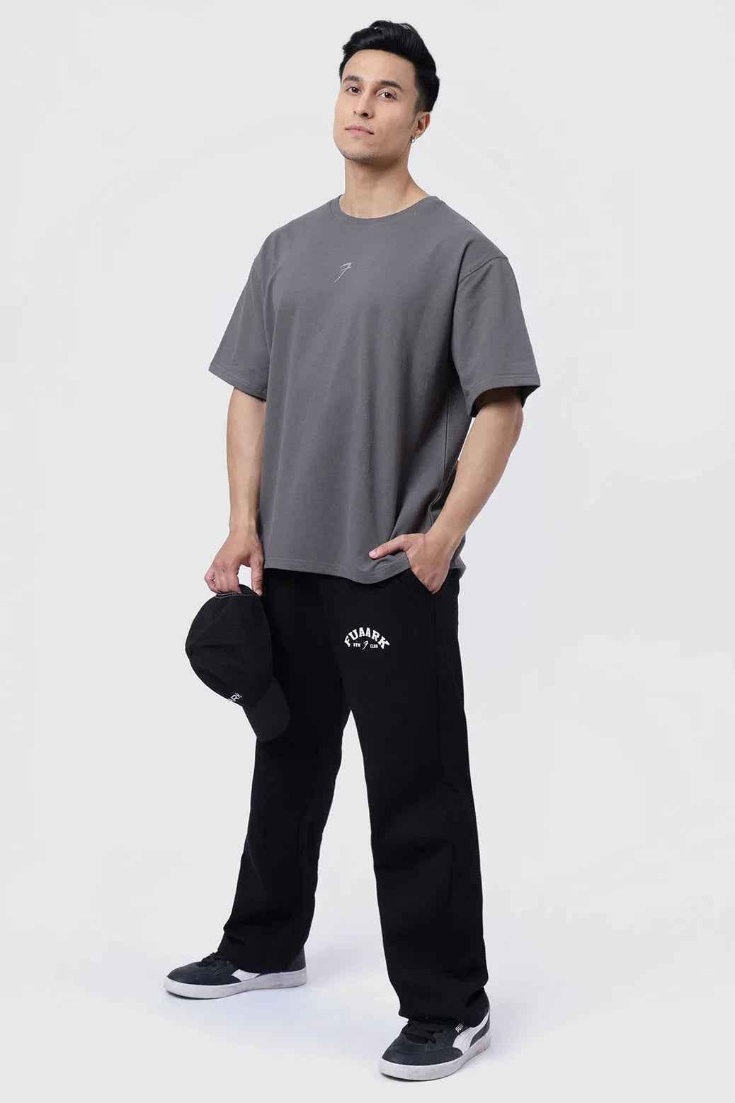 Fuaark NZ laidback relaxed black track pants with a comfortable fit, shown on a model, ideal for casual and active wear.