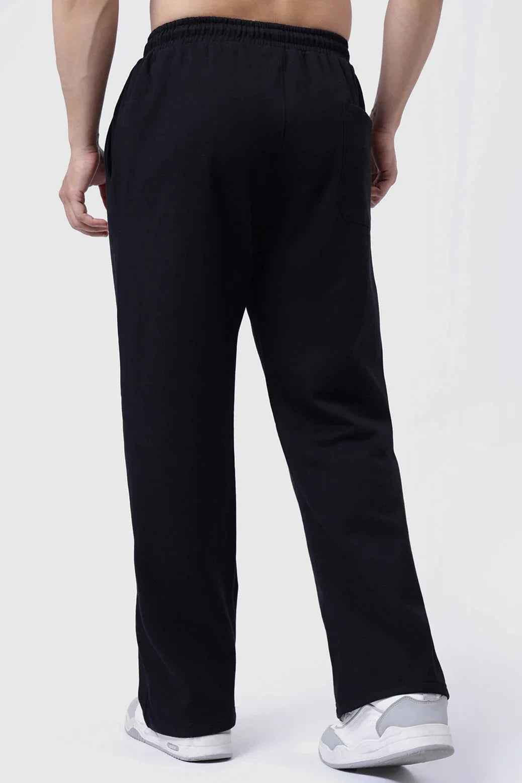 Fuaark Nz black relaxed fit track pants with a laidback design, ideal for comfort and casual wear.