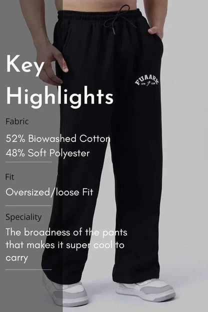 Fuaark NZ black relaxed fit track pants for ultimate comfort, laidback style, with a comfortable waistband and tapered legs.
